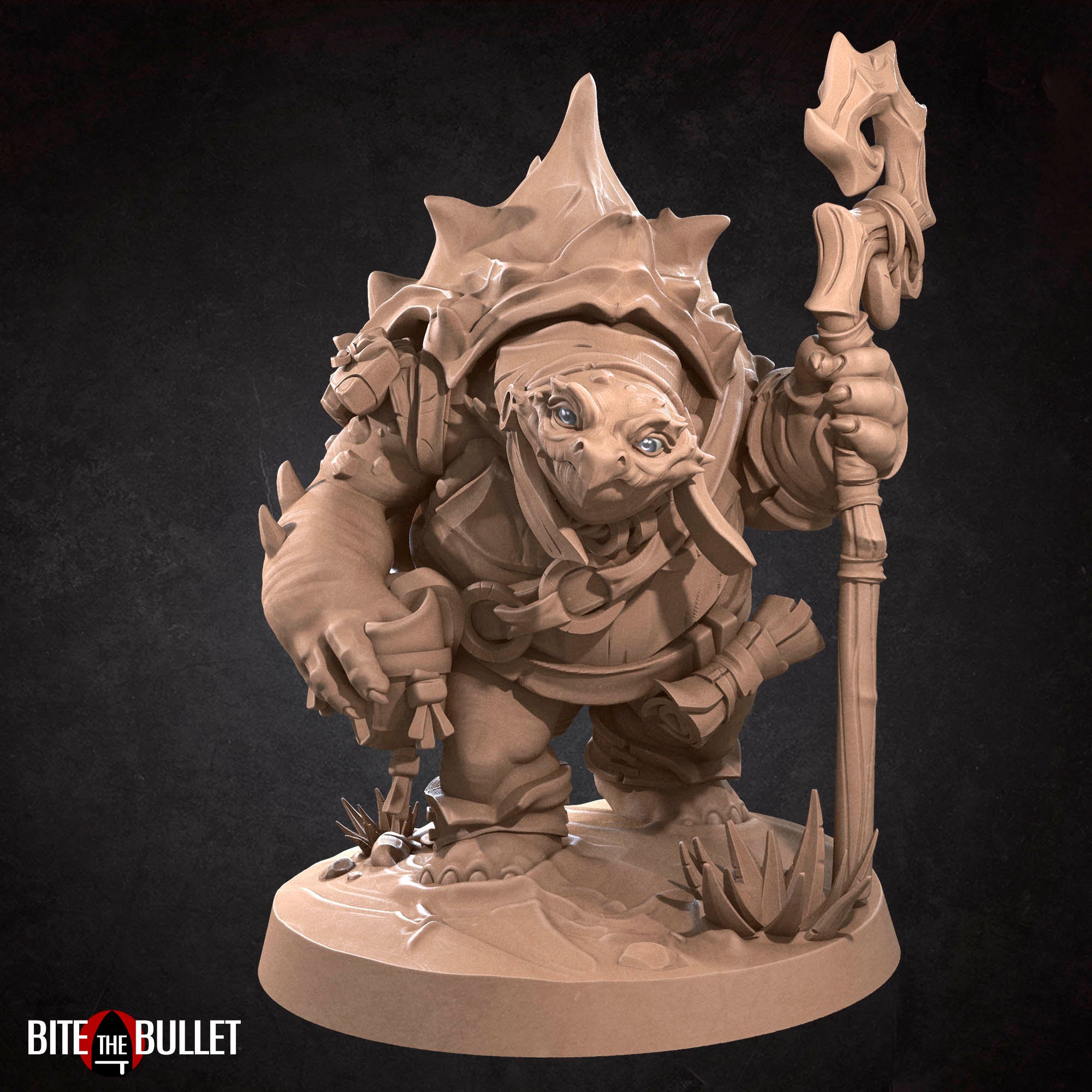 Anthropomorphic turtle with a kindly expression, holding a staff. Resin miniature by Bite the Bullet.